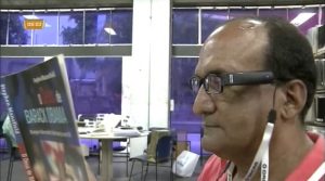 Uma reportagem do programa Bahia no Ar, da TV Record Itapoan, apresentou aos telespectadores a tecnologia OrCam, além de falar sobre o uso da mesma na Biblioteca Central da Bahia. Record TV Itapoan 300x167 - Uma reportagem do programa Bahia no Ar, da TV Record Itapoan, apresentou aos telespectadores a tecnologia OrCam, além de falar sobre o uso da mesma na Biblioteca Central da Bahia.